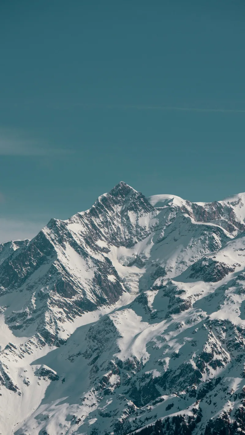Jagged snowy peaks under a clear sky