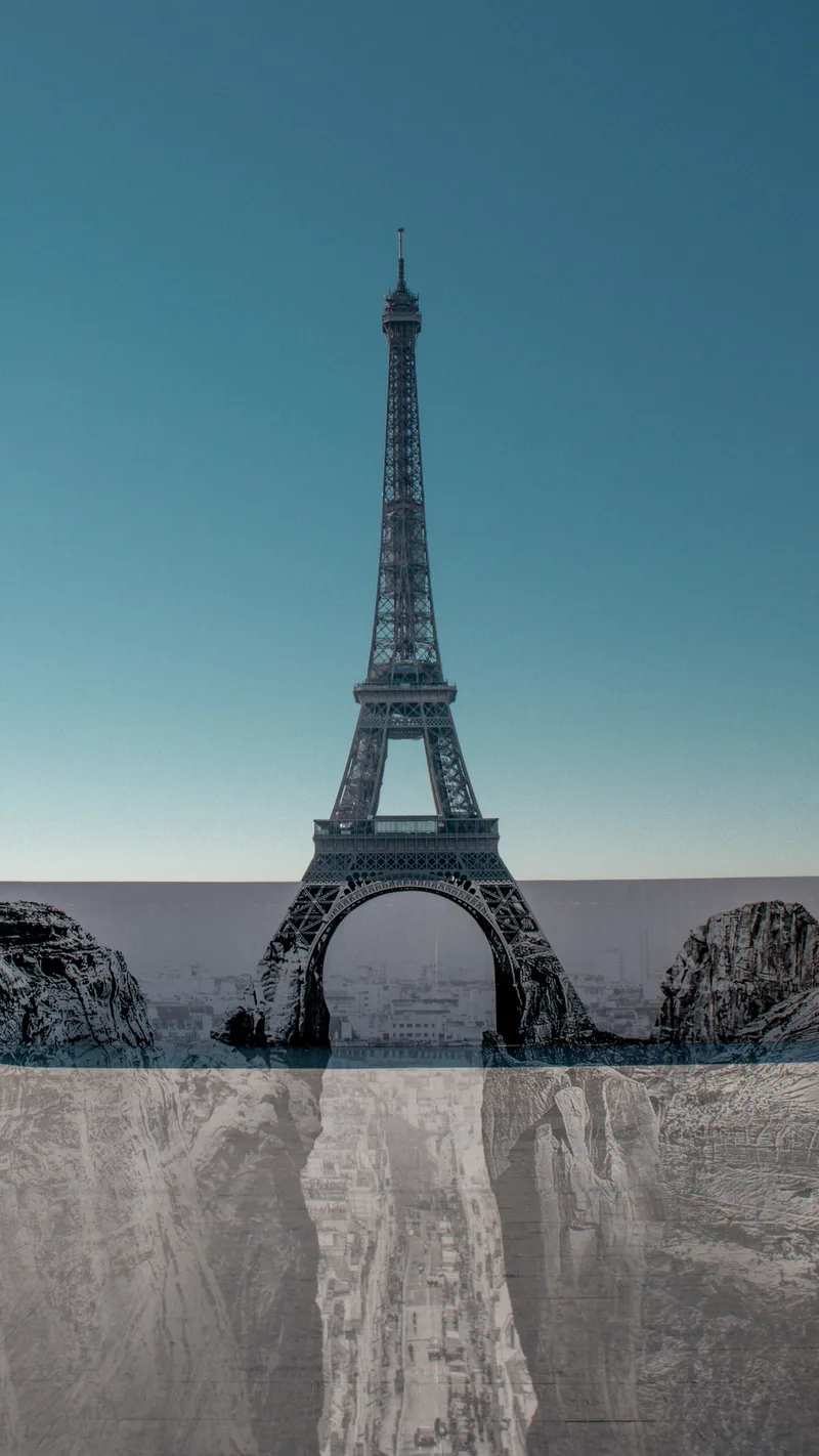 The Eiffel Tower above a stone surface and its reflection