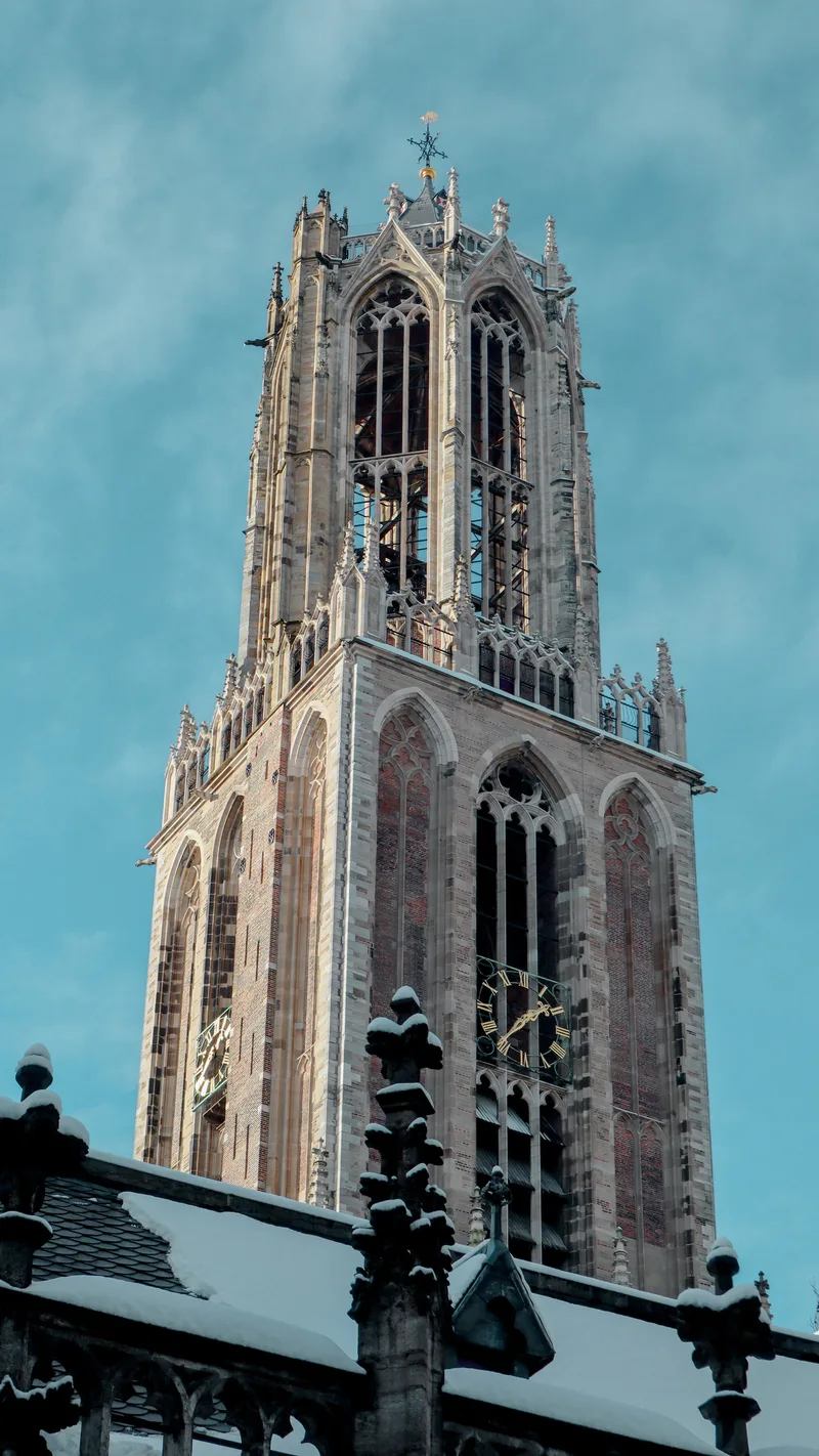 The Gothic Dom Tower with snow on the railings below