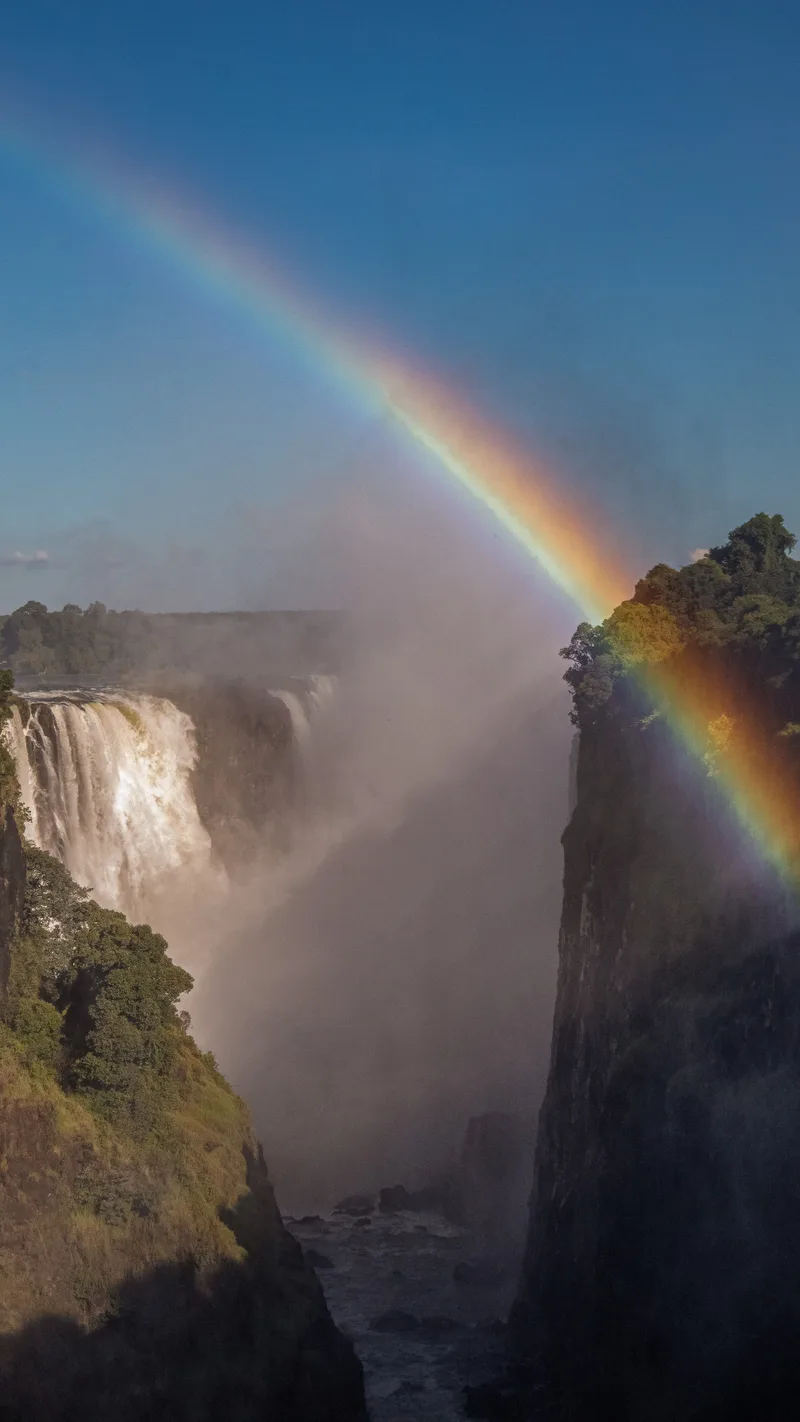 A rainbow arching over the gorge at Victoria Falls